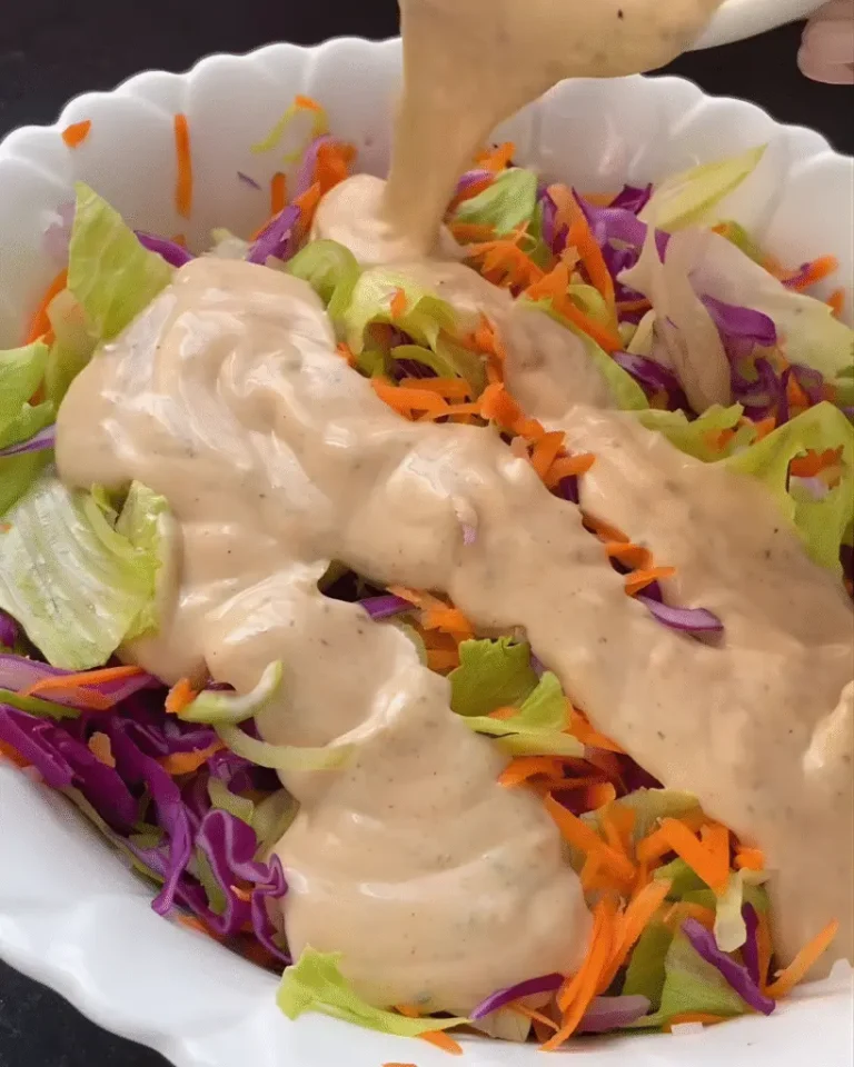 Homemade dressing served over salad